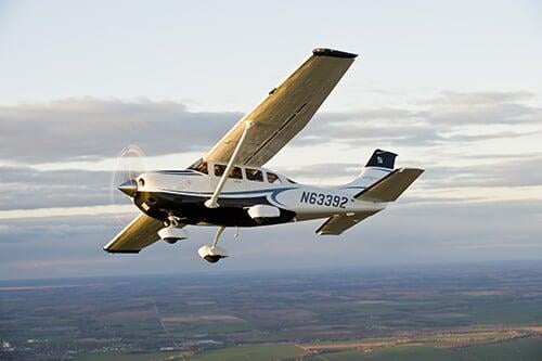 A photo of a Cessna in flight